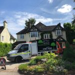 An image of the AP Tree Services vehicles at a property